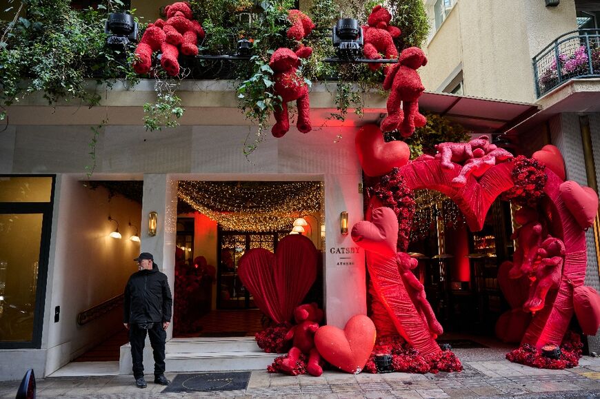 A man stands in front of the hotel where Dana Eden, the producer of the TV series "Tehran," was found dead in her room in central Athens, on February 16, 2026