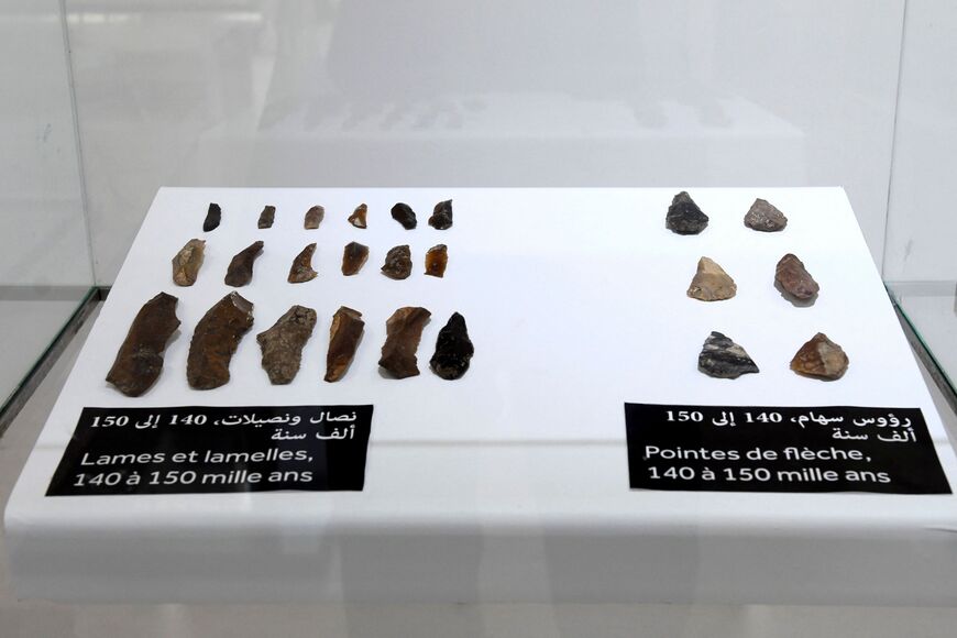 A picture taken on November 18, 2021 in Rabat shows artefacts unvailed by archaeologists in Morocco which they say are one of the oldest in the world. - Archaeologists in Morocco unveiled what they said was the oldest jewelry in the world, perforated seashells dating back as much as 150,000 years. The shells, assumed to have formed necklaces and bracelets, were discovered in the Bizmoune cave near the coastal resort of Essaouira. They were dated as 142,000-150,000 years old, according to researcher Abdeljal