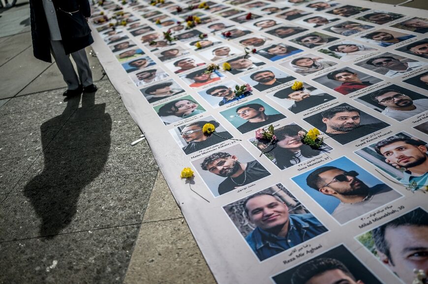 Demonstrators displayed portraits of Iranians killed during recent protests on the sideline of the 61st session of the UN Human Rights Council in Geneva