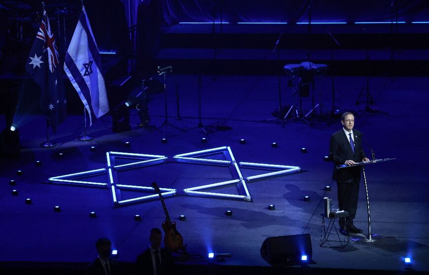 Israeli President Isaac Herzog delivers a speech as he participates in an event titled 'An Evening of Light & Solidarity' for the victims of the December 14, 2025 gun attack in Sydney on February 9, 2026