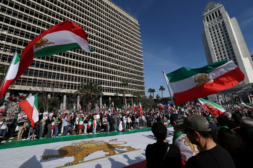 Demonstrators take part in a march  in Los Angeles in support of the people of Iran