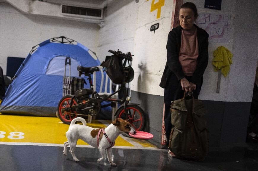 Dogs on leads and cats in carriers have been seen by AFP journalists running for cover and waiting in the underground shelters studding the city for the all-clear. 