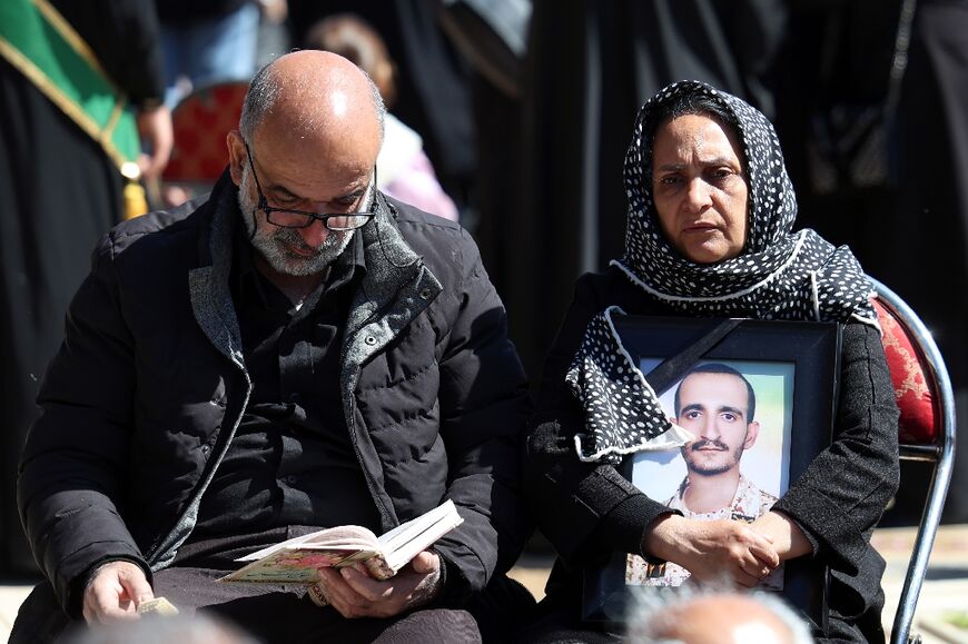 Mourners at a funeral for victims of the Middle East war, in Tehran