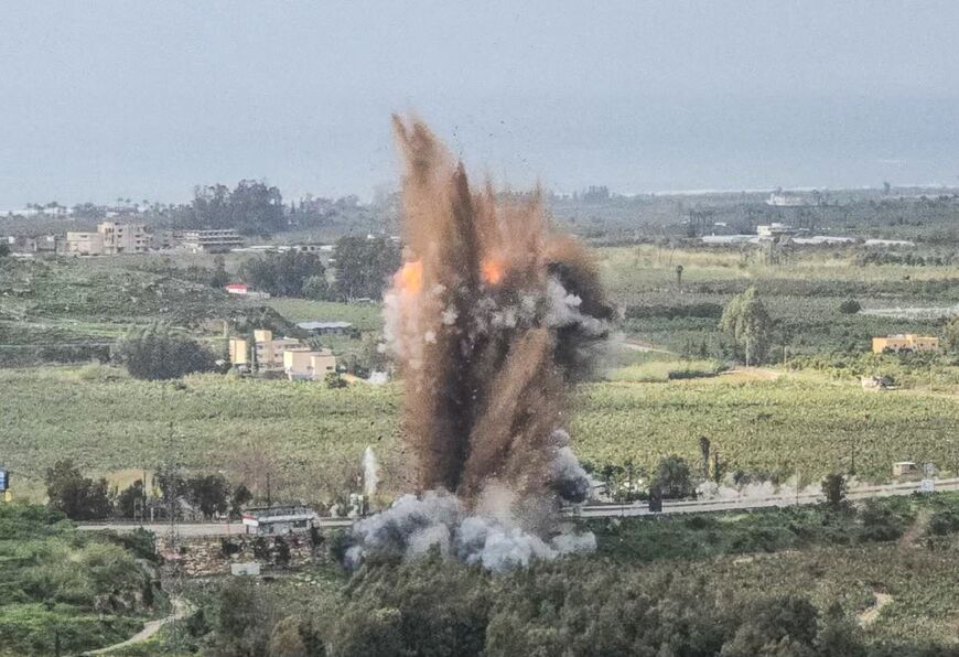 Smoke rises from an Israeli airstrike on the Qasmiyeh bridge in south Lebanon on March 22, after Israel said the bridge was being used by Hezbollah