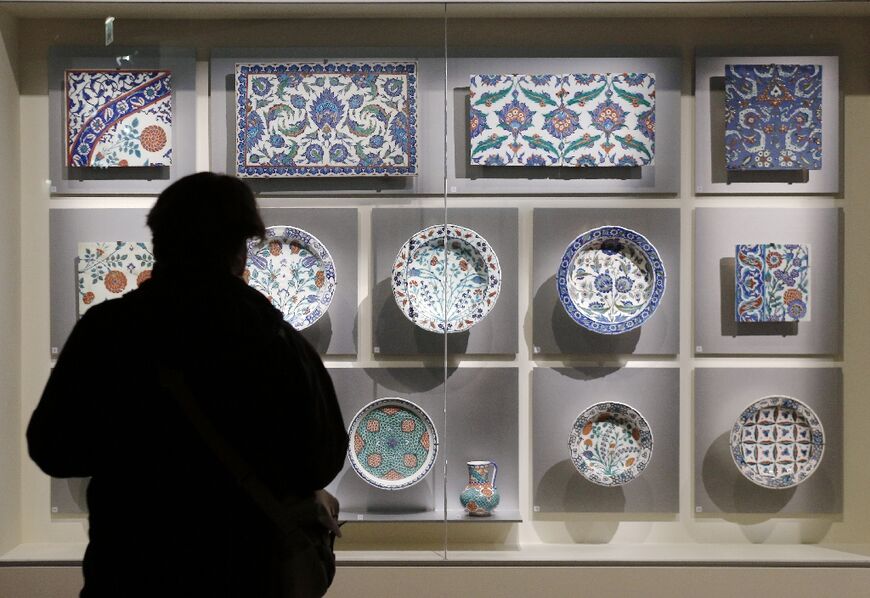 A visitor looks at Ottoman-era Iznik tiles at the Louvre - Turkey says it is trying to retrieve several dozen similar tiles from the Paris-based museum 