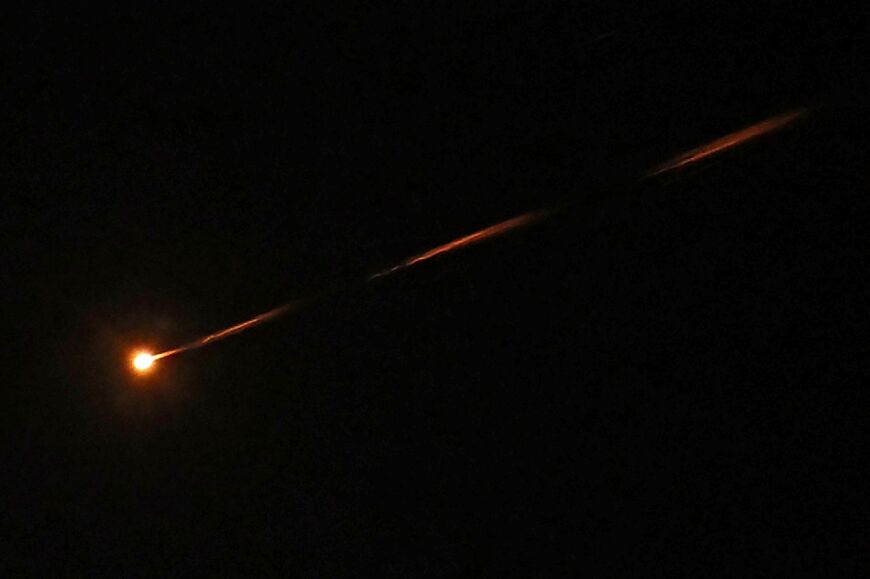 A missile streaks accross the sky over Jerusalem amid a fresh barrage of Iranian missiles on March 30, 2026
