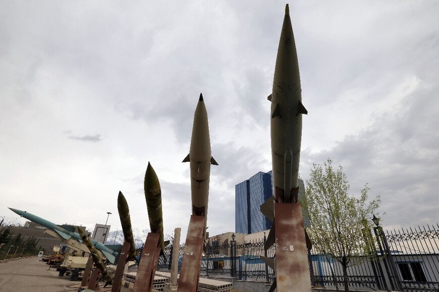 Mockups of domestically-made Iranian missiles are displayed at an exhibition outside the Defence Museum in Tehran on March 31, 2026