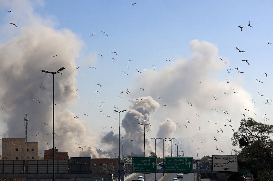 A plume of smoke rises after a strike on Tehran