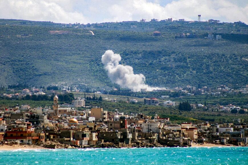 Smoke rises from the site of Israeli bombardment on the southern Lebanese village of Qlaileh on March 25, 2026