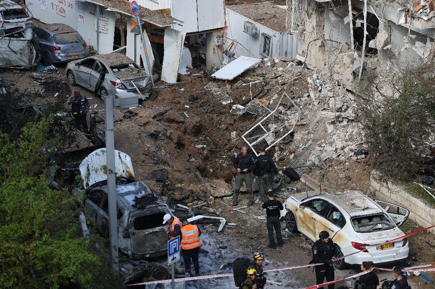 The site of an Iranian missile strike in Tel Aviv on March 24, 2026