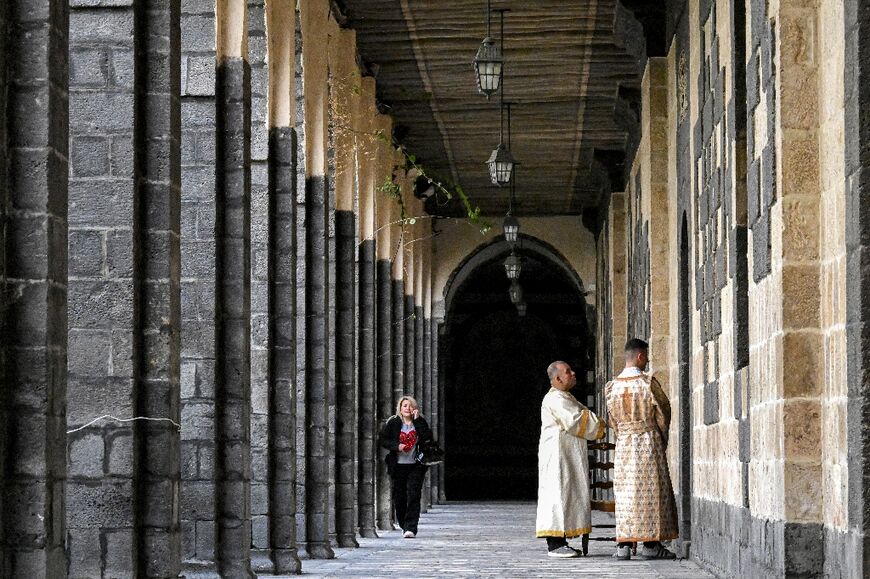 Clergymen outside the cathedral during Palm Sunday service