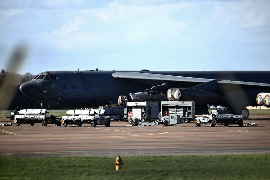 US military personnel loaded missiles onto a bomber at the Fairford base