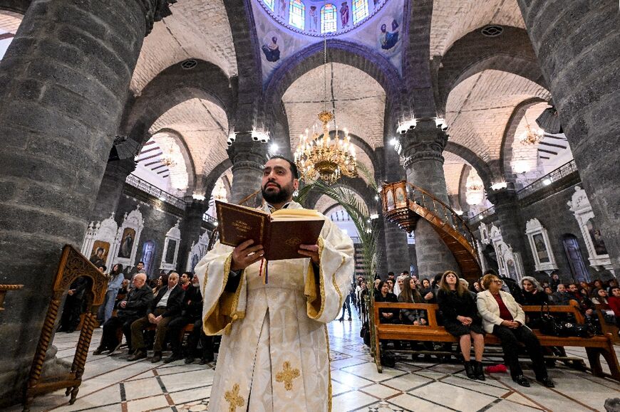 Christians attend the service at the Cathedral of Our Lady of Dormition, headquarters of the Melkite Greek Catholic Patriarchate