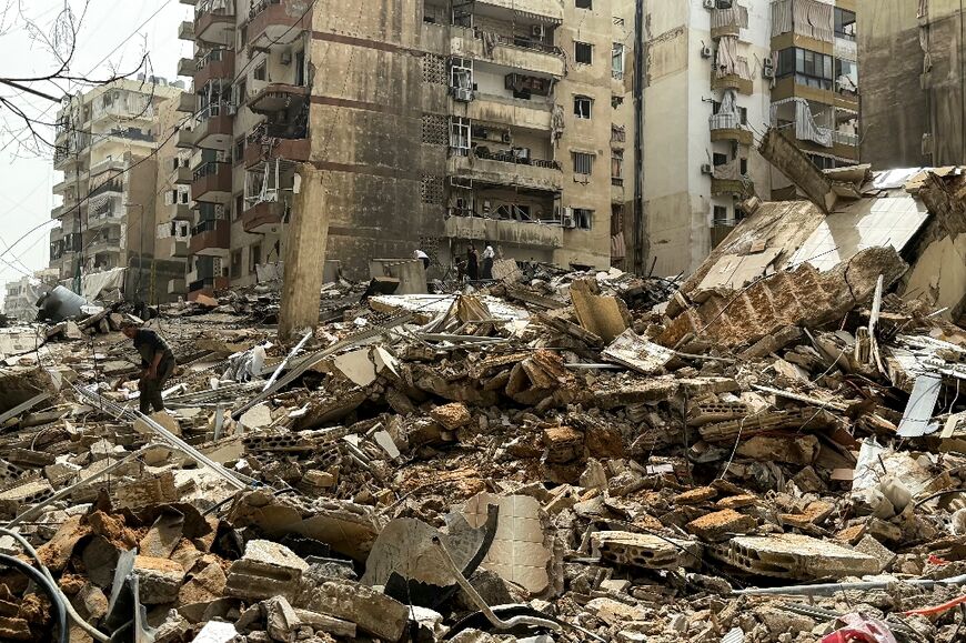 Displaced residents inspect the damage as they return to their homes in Beirut’s southern suburbs 