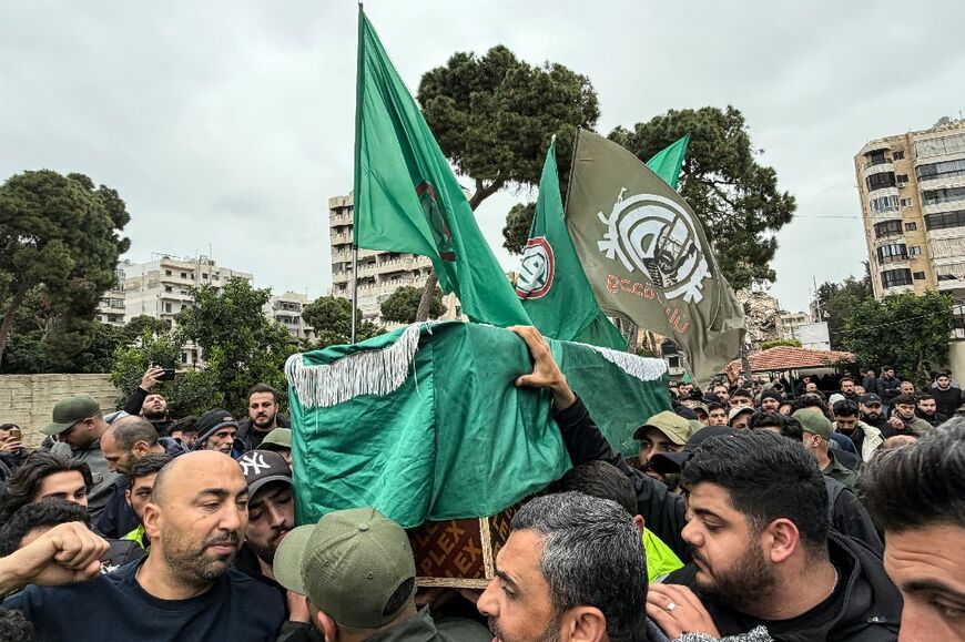 Mourners carry the coffin of a militant from the Hezbollah-allied Amal movement killed in southern Lebanon during his funeral in the Shayyah neighbourhood of Beirut’s southern suburbs on April 2, 2026. Lebanon was drawn into the Middle East war on March 2 when Tehran-backed militant group Hezbollah launched attacks on Israel to avenge the killing of the Iranian leader