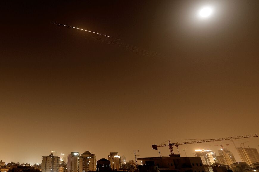 Rocket trails are seen in the sky above the Netanya, Israel, on April 4, 2026.