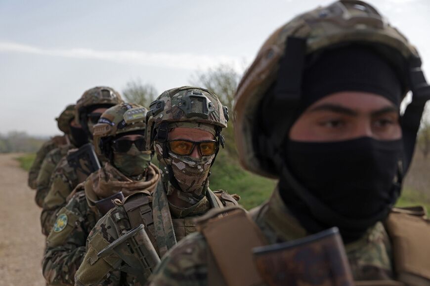 Syrian soldiers patrol the border with Lebanon in the rural Qusayr area