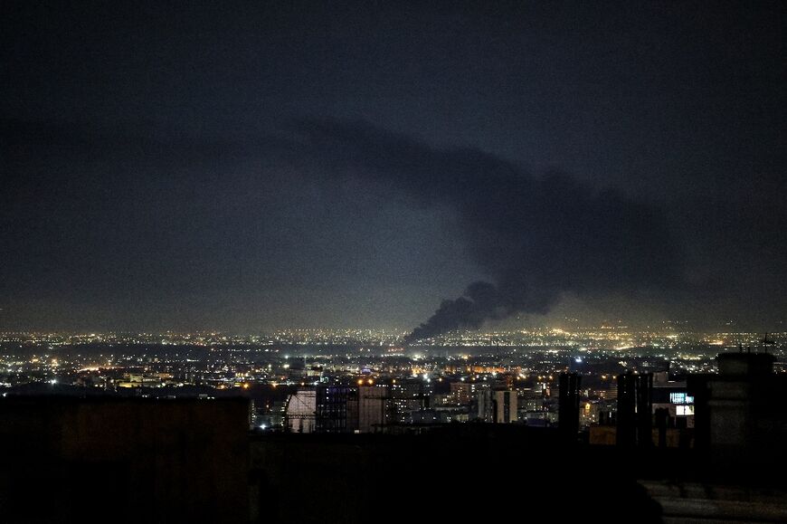 Smoke rises from the site of a US-Israeli strike on the Iranian capital Tehran before the ceasefire was struck