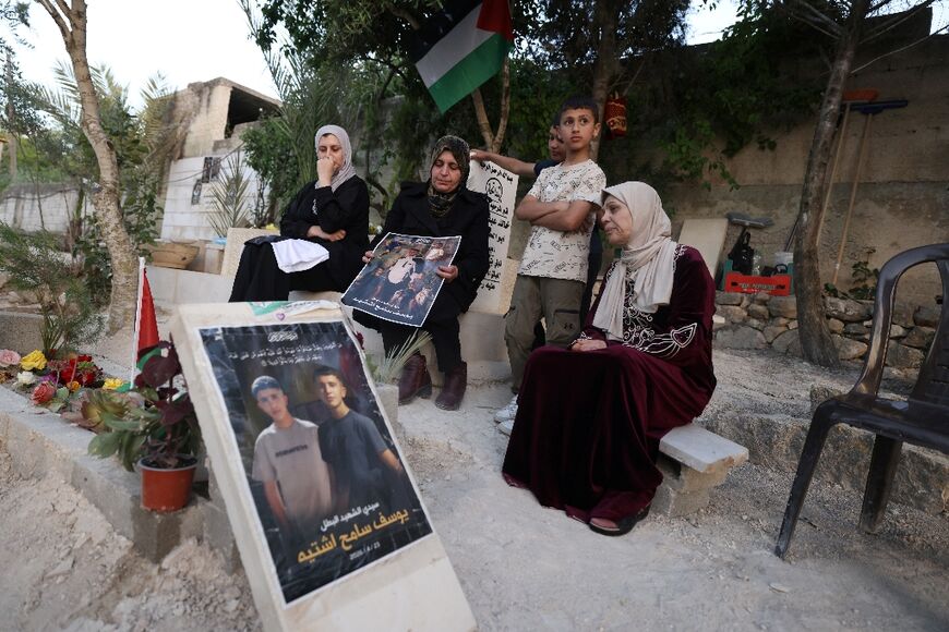 Relatives visit Youssef's grave after he was shot by an Israeli soldier just 100 metres from his home