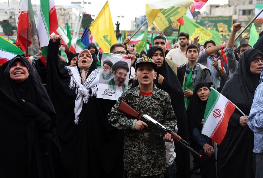 Supporters of Iranian supreme leader Ayatollah Mojataba Khamenei rally in Tehran this week