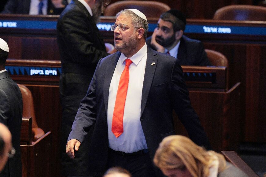 Israel's National Security Minister Itamar Ben Gvir stands at the Israeli parliament, the Knesset, ahead of an address