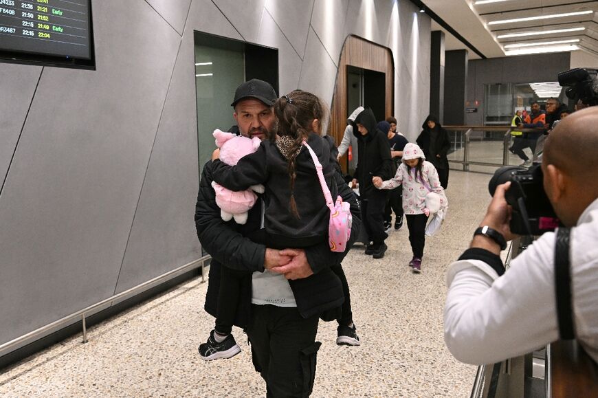 A group of Australian women linked to Islamic State fighters returned home from a camp in Syria, some landing at Melbourne airport