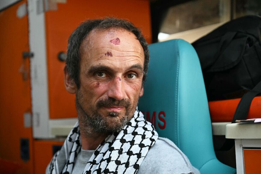 A member of the Global Sumud Flotilla deported by Israel receives medical attention following the group's arrival at Istanbul Airport 