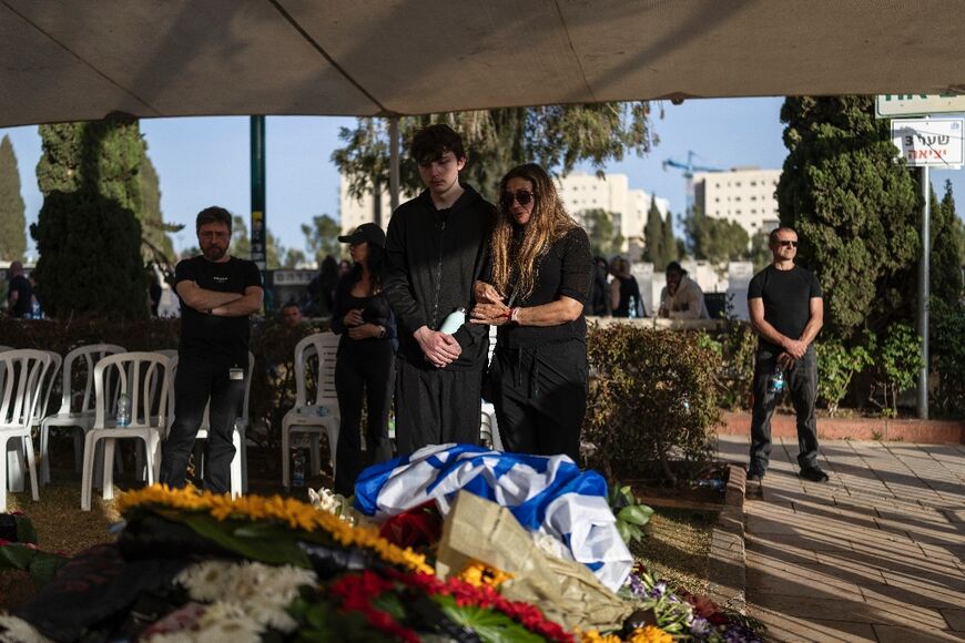 Relatives mourn at the funeral of an Israeli sergeant major killed in fighting near the border with Lebanon