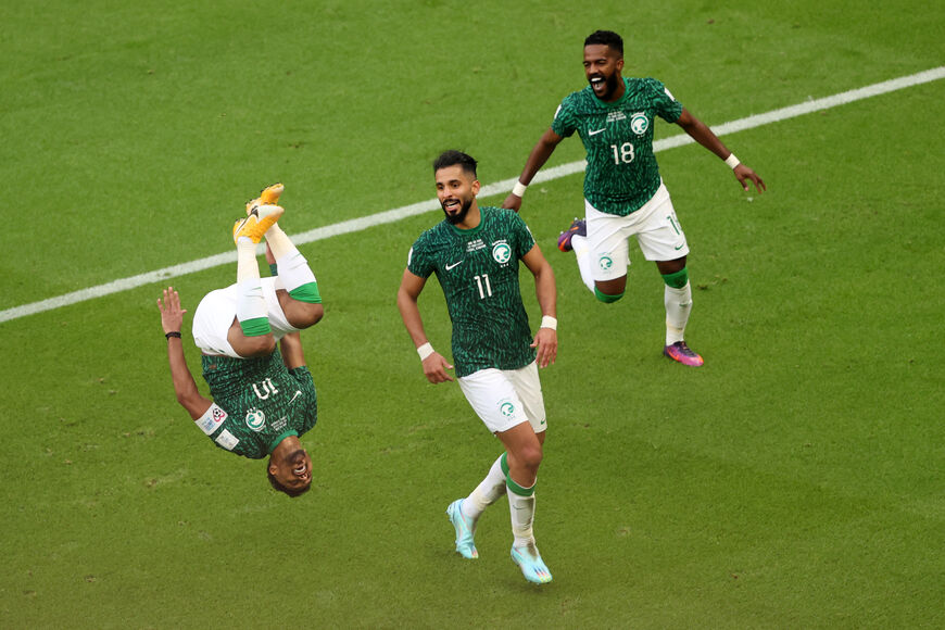 Salem Al-Dawsari of Saudi Arabia celebrates with teammates after scoring their team's second goal during the FIFA World Cup Qatar 2022 Group C match between Argentina and Saudi Arabia at Lusail Stadium on November 22, 2022 in Lusail City, Qatar. (Photo by Julian Finney/Getty Images)
