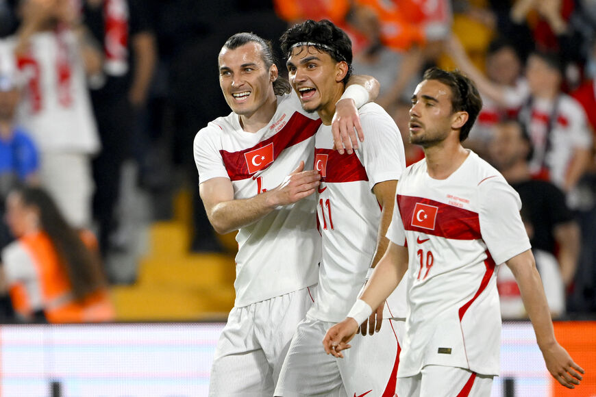 Turkey's midfielder #11 Can Uzun (C) celebrates with Turkey's midfielder #19 Yunus Akgun (R) and Turkey's defender #4 Caglar Soyuncu (L) after scoring his team's second goal during the international friendly football match between Turkey and North Macedonia at the Chobani stadium in Istanbul on June 1, 2026, ahead of the 2026 FIFA World Cup. (Photo by Yasin AKGUL / AFP via Getty Images)