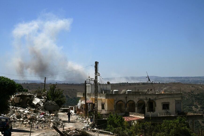 A photograph taken from Zawtar al-Gharbiyah, where the Lebanese army recently deployed, shows smoke rising from the site of an Israeli-controlled explosion in the nearby village of al-Qantara