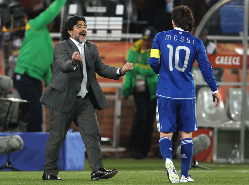 POLOKWANE, SOUTH AFRICA - JUNE 22: Diego Maradona head coach of Argentina celebrates victory with Lionel Messi during the 2010 FIFA World Cup South Africa Group B match between Greece and Argentina at Peter Mokaba Stadium on June 22, 2010 in Polokwane, South Africa. (Photo by Phil Cole/Getty Images)