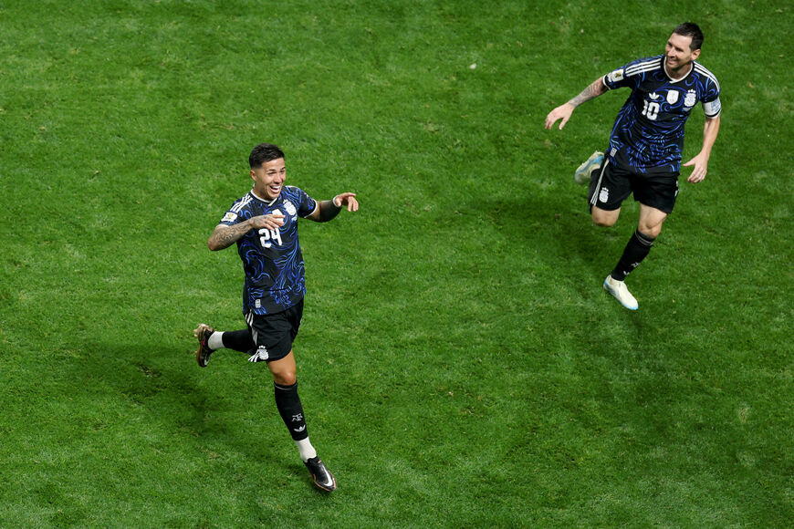 Argentina's midfielder #24 Enzo Fernandez celebrates scoring his team's first goal with Argentina's forward #10 Lionel Messi during the 2026 World Cup football tournament semi-final match between England and Argentina at the Atlanta Stadium in Atlanta on July 15, 2026. (Photo by PATRICIA DE MELO MOREIRA / AFP via Getty Images)