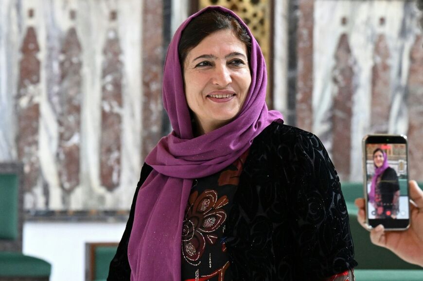 Syria's member of parliament Fasla Yousef poses inside one of the halls of parliament in Damascus on July 27, 2026