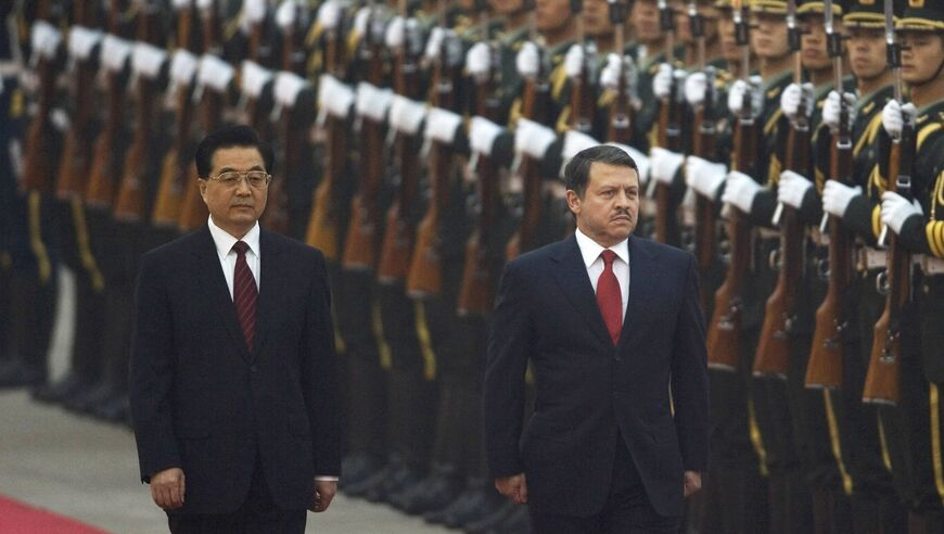 King Abdullah II of Jordan (R), accompanied by Chinese President Hu Jintao, reviews a guard of honour during a welcoming ceremony at the Great Hall of the People on October 30, 2007 in Beijing, China. King Abdullah II is on his fifth visit to China to celebrate the 30th anniversary of the establishment of diplomatic relations between the two countries. (Photo by Andrew Wong/Getty Images)