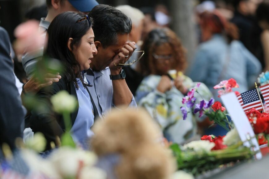 People shed tears at the 9/11 remembrance ceremony at Ground Zero in New York