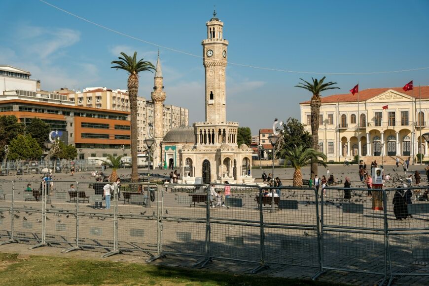 Ahead of an evening protest, police began erecting barricades in Izmir's main squares