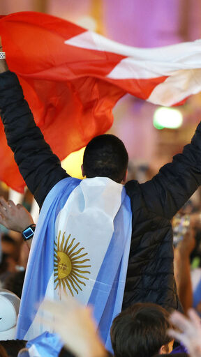 DOHA, QATAR - DECEMBER 17: Fans of Argentina gather at Souk Waqif to show support to their team on the day before the final match of the FIFA World Cup Qatar 2022 against France on December 17, 2022 in Doha, Qatar. (Photo by Mohamed Farag/Getty Images,)