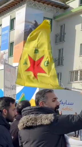 Kurdish protesters gather outside of USA house in Davos, Switzerland at the World Economic Forum with flags of Kurdistan